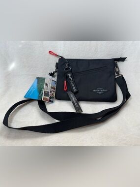 Sherpani Black Crossbody Bag with Red Zip Pulls AntiTheft NWT